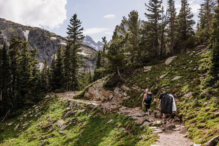 A Bride and Groom Hiking in the Rocky Mountains to a Private Elopement Lakeside