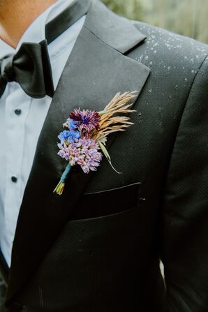 Colorful Boutonniere With Purple, Blue, Lavender and Yellow Flowers With Minimal Greenery