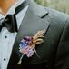 Colorful Boutonniere With Purple, Blue, Lavender and Yellow Flowers With Minimal Greenery