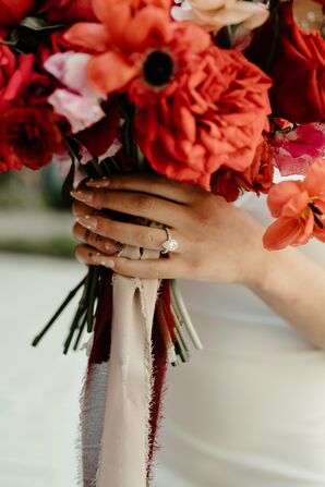 Hand With Engagement Ring Holding Bouquet