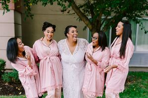 Bridesmaids in Pink Robes Laughing With Bride