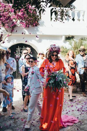 Couple Recessing Amid Cascade of Rose Petals in Menorca, Spain