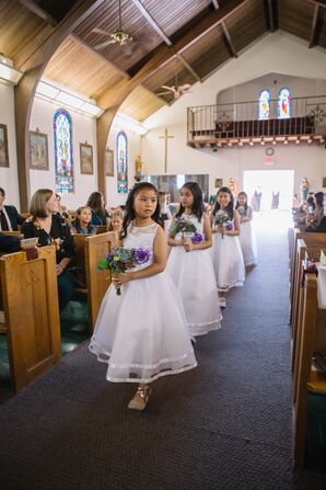 Elegant Flower Girls in White Dresses Carrying Bouquets