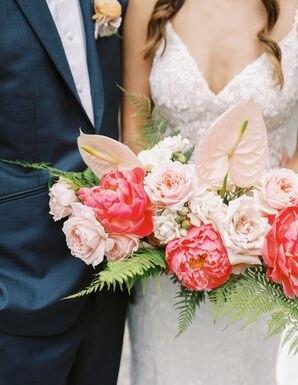 Groom and Bride Holding Wide Tropical Bouquet With Blush and Coral Flowers, Ferns