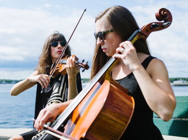Violinist and Cellist playing at a wedding ceremony. 