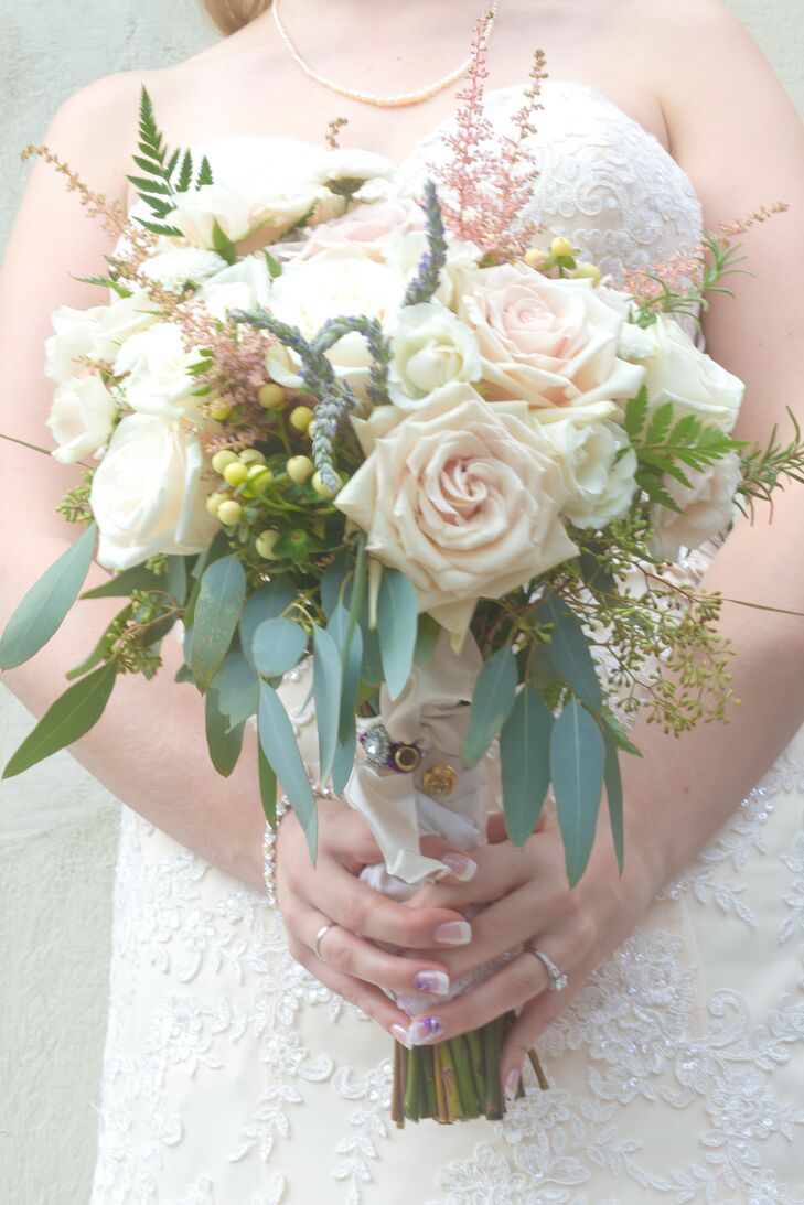 Jennie carried a lush bouquet with Sahara roses, Vendela roses, cream hypericum berries, pink astilbes, ferns and eucalyptus.