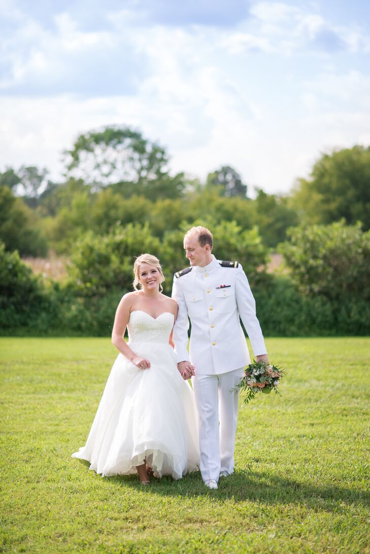 “I wanted my dress to have the classic-bride feel that would work for our military and outdoor wedding,” Morgan says. On her wedding day, Morgan donned an Essence of Australia ball gown with an organza skirt, lace and a sweetheart bodice. “It was the perfect mix of elegant, sexy and classy.” Park looked handsome in his choker whites, the formal Navy summer uniform.