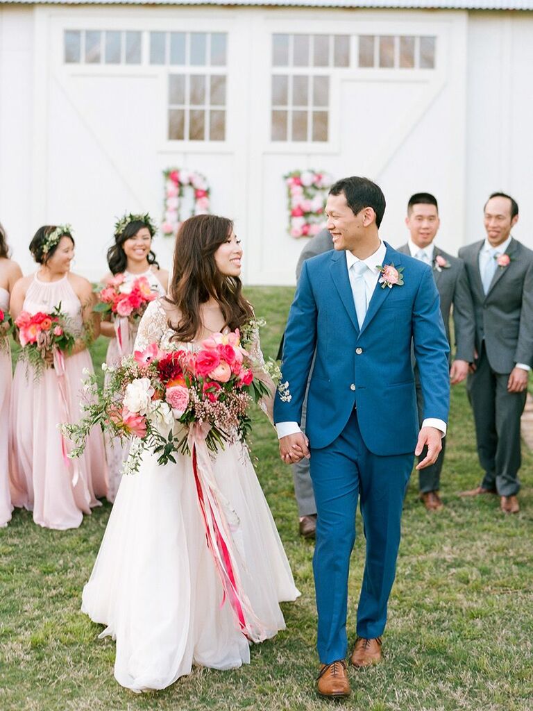 bride and groom with pink florals in Texas