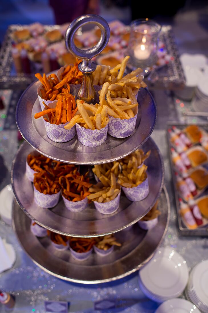 Jenna and Tom had plenty of extra snacks for their guests. We can't get over this display of french fries and mini sliders. Who knew mini fry cups on a metallic tiered display could turn this snack into chic?