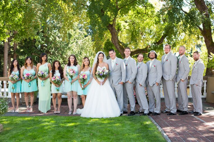 The bridesmaids chose their own dress in a shade of mint, which resulted in a range of styles and hues that went together nicely. The dresses matched the groomsmen's mint green bow ties and pocket squares.