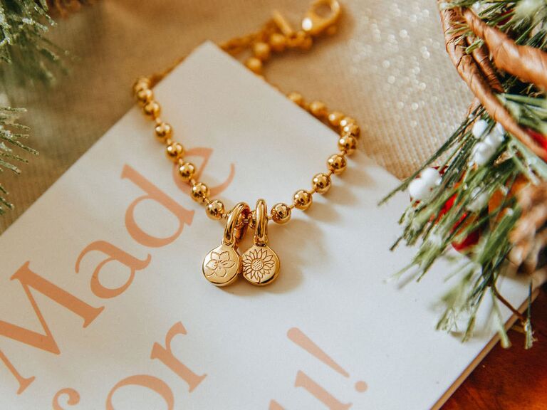 Gold birth flower charm bracelet for someone whose love language is receiving gifts