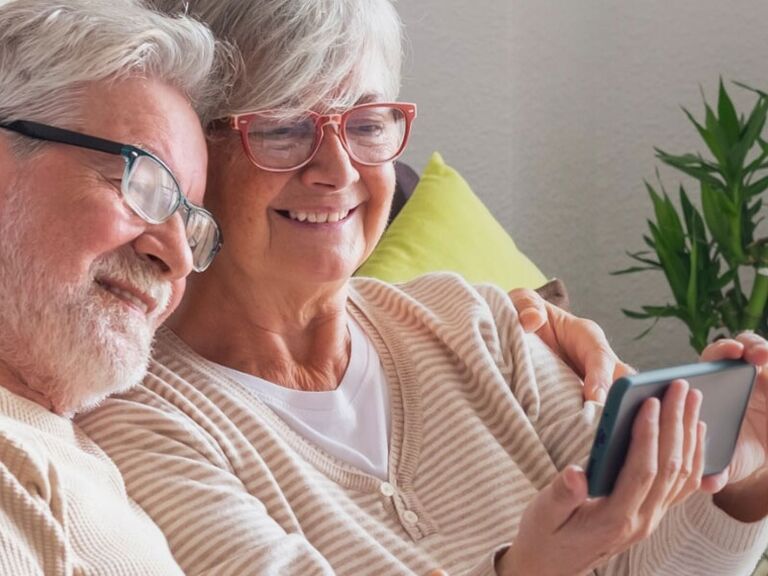 Couple watching custom video montage words of affirmation gift idea