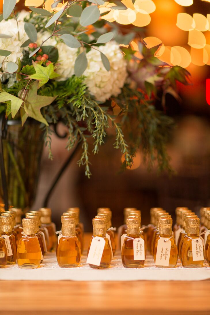 For a locally inspired wedding favor, Pam and Caleb attached hand-printed thank-you tags to miniature bottles of Vermont maple syrup. The syrup came from Sugar House, which they toured during their first visit to Vermont together.