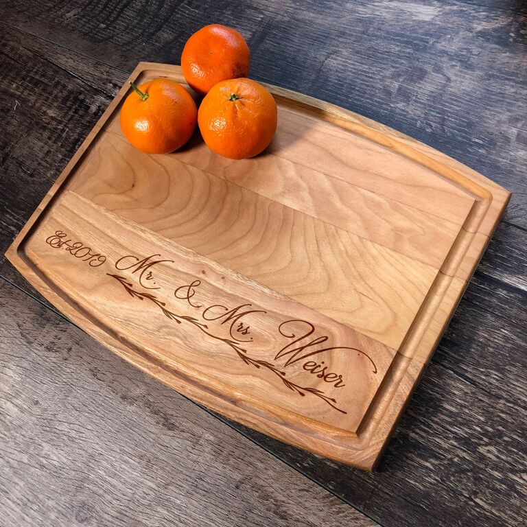 Custom engraved Mr. and Mrs. wooden cutting board. 2023 gifts for newlyweds. 