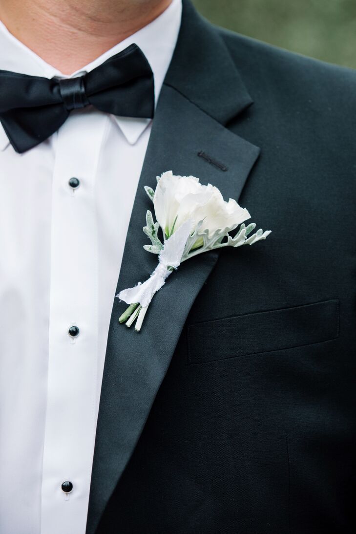 Jake accessorized the lapel of his classic black tuxedo with a simple white bloom.