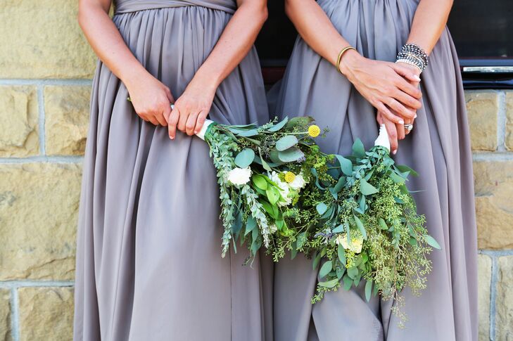 Bridesmaids carried natural arrangements that included seeded eucalyptus, eucalyptus leaves and craspedia for an added pop of color.