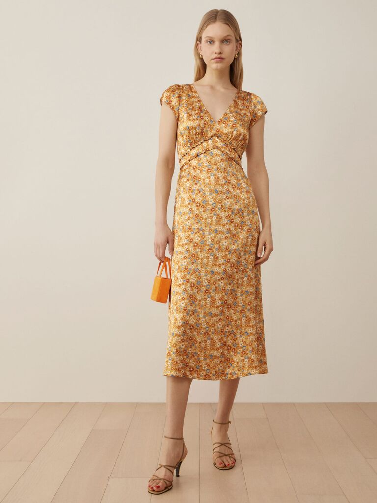 Reformation orange and yellow floral slip dress for wedding guests