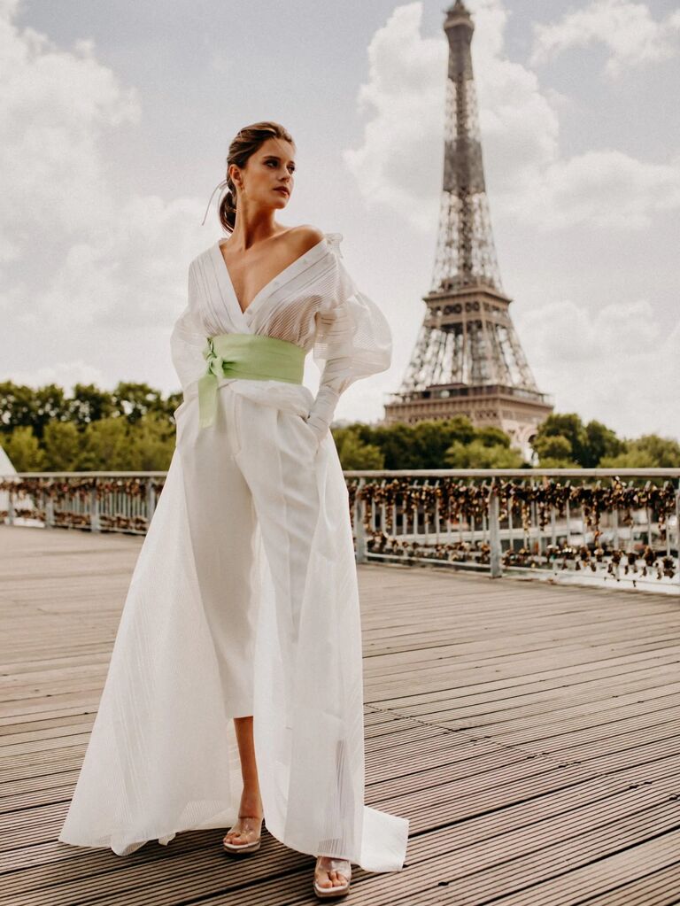 Model wears a wedding dress by French designer Cymbeline. 