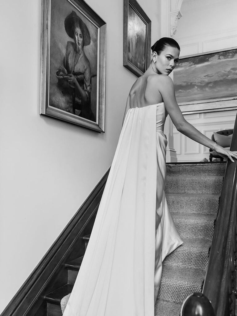 Georgia Fowler looks over her shoulder while walking up the stairs on her wedding day. 