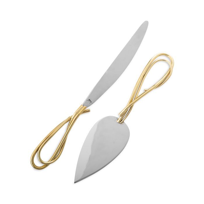Gold and silver cake cutting set by Michael Aram. 
