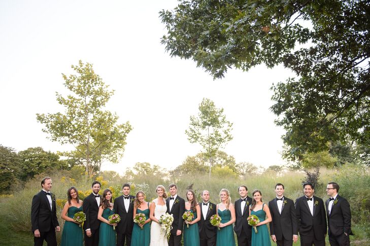 The groom wore a classic Armani tux purchased at Neiman Marcus on Michigan Avenue for a look that matched his groomsmen. The bridesmaids wore emerald-green floor-length Amsale gowns in various styles.