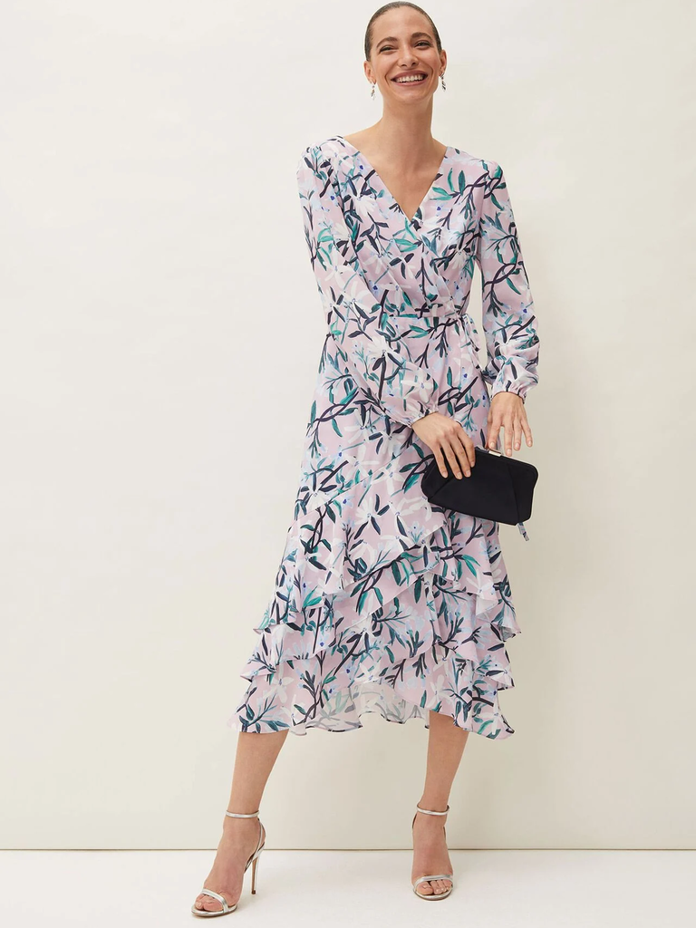 A model wears this V-neck mother of the bride gown with long sleeves and a floral print.