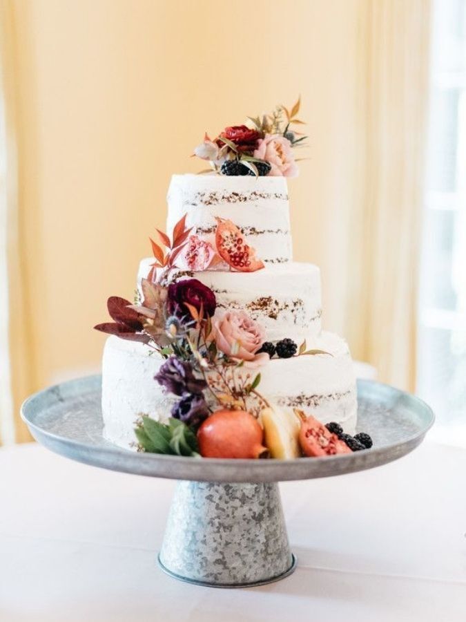 semi-naked cake with fall fruit and dried leaves