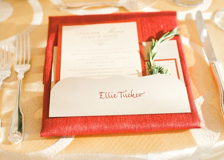 The names of each guest were hand-calligraphed in red ink on simple ivory cards, complementing the linens and menu cards on which they were laid.