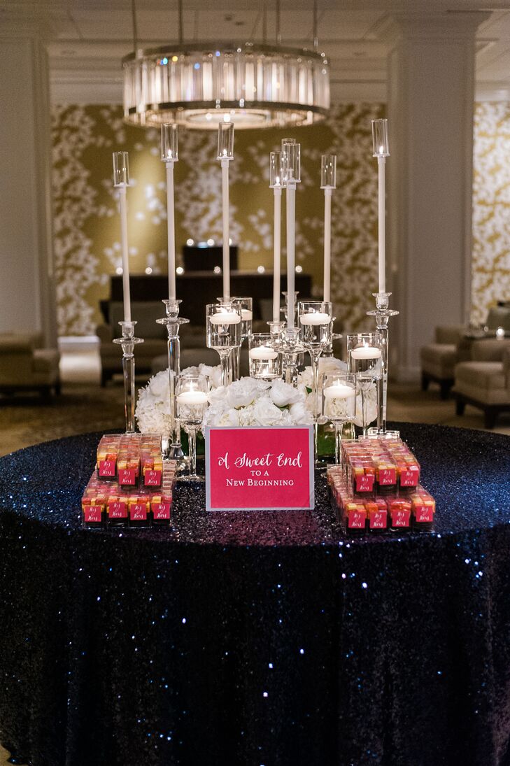 As guests made their exit after a night filled with dancing and celebrating, they scooped up a box of perfectly packaged sweets displayed on a table dressed with sparkling navy sequins and romantic candlelight.