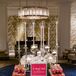 As guests made their exit after a night filled with dancing and celebrating, they scooped up a box of perfectly packaged sweets displayed on a table dressed with sparkling navy sequins and romantic candlelight.