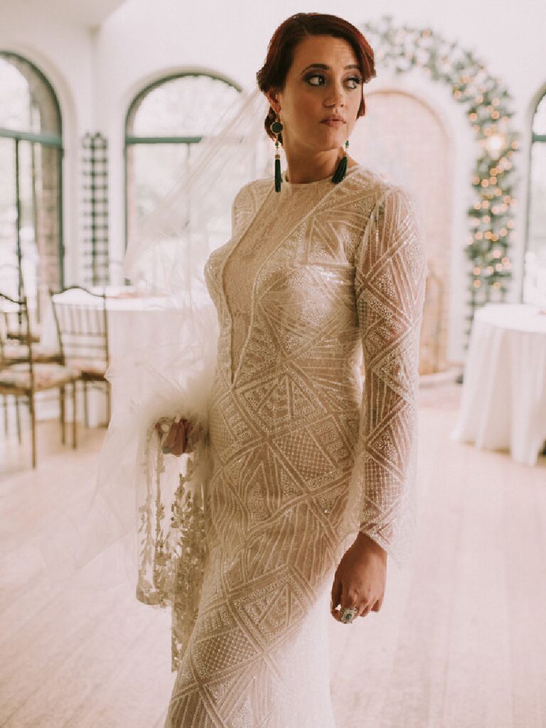 Bride wearing long sleeve beaded Art Deco-inspired wedding dress
