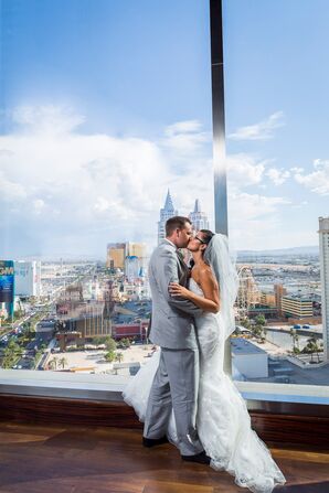 Couple Kiss Against Las Vegas Backdrop