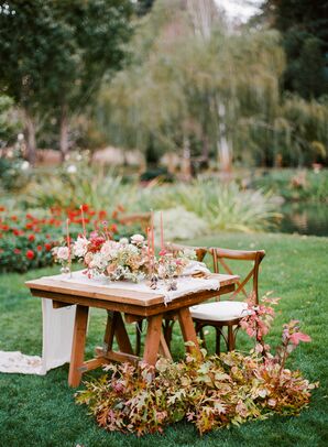 Romantic Sweetheart Table with Fall Leaves and Red Candles