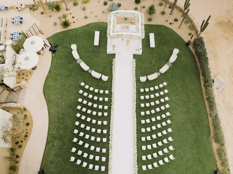 A modern, all-white wedding ceremony site.