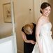 Bride Getting Ready with an A-Line Wedding Dress and Bow