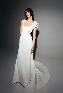 high fashion wedding dress with puffy sleeves and tiered skirt