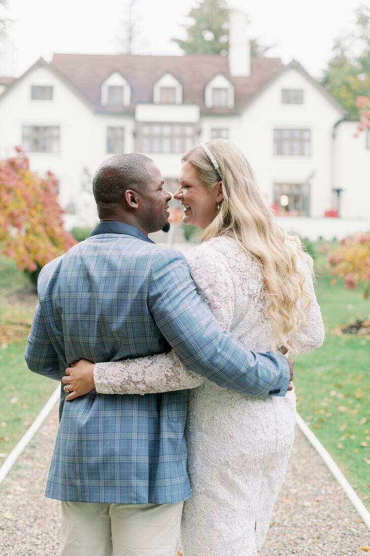 Bride in Vintage Lace Dress, Headband With Groom in Plaid Blue Suit Jacket Embracing