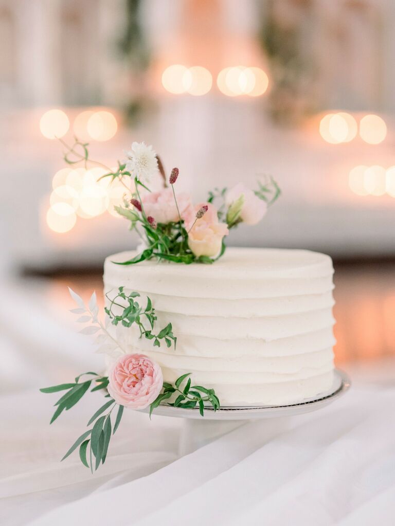 one tier white buttercream cake with pink juliet garden roses and greenery