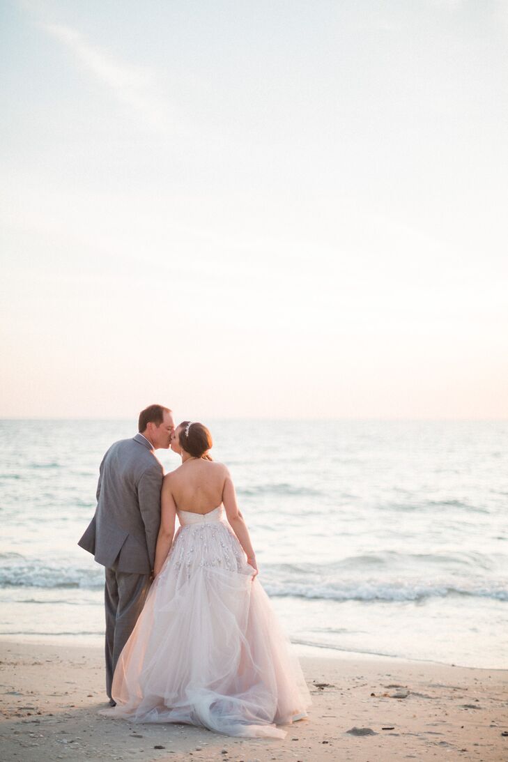 Since they were having a beach wedding, finding a comfortable, sand-friendly dress was key. So when Stephanie saw a stunning beaded gown by Hayley Paige, she knew it was the one. The sweetheart neckline and bodice were covered with intricate beading and crystal accents. A similar detail with added sequins even cascaded down the organza skirt in a shape that resembled sea coral. It was perfect for their waterfront nuptials. “What made it even better was that Hayley Paige was at Kleinfeld's that day, so I was able to say 'yes to the dress' with the newly engaged designer,” Stephanie says.
