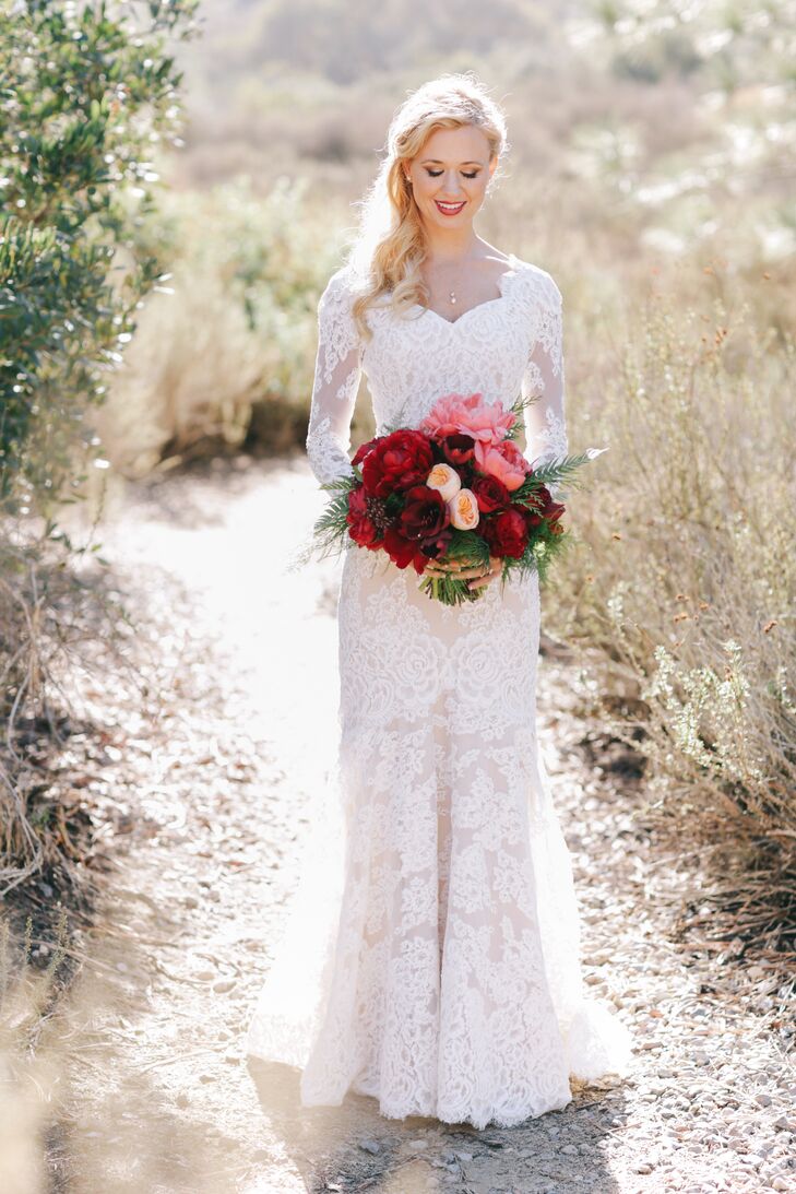 Carlie's sleeved wedding gown and bouquet of deep oxblood blooms created a dramatic, slightly vintage bridal look.