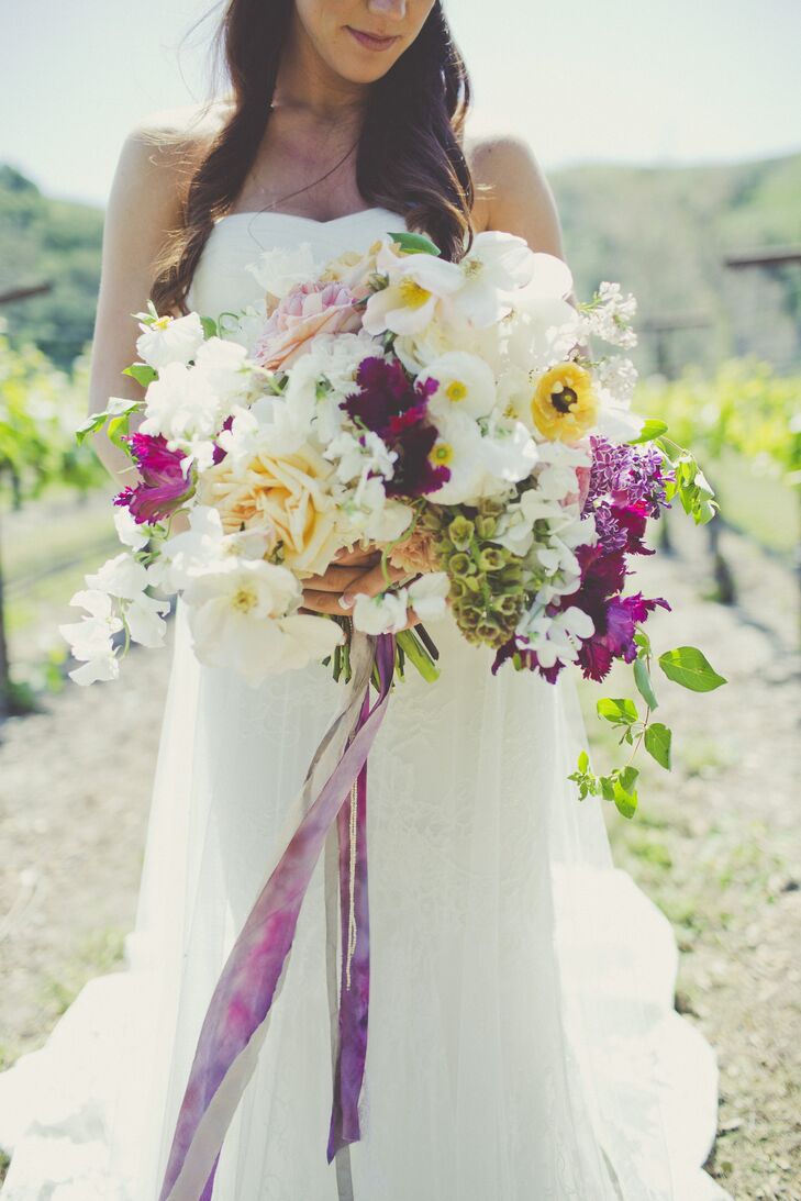 The bride’s overgrown bouquet brought color to the otherwise neutral event. We used neutral colors throughout the wedding, and added color with the flowers that were in the bouquets and on the tables, Lindsey says.