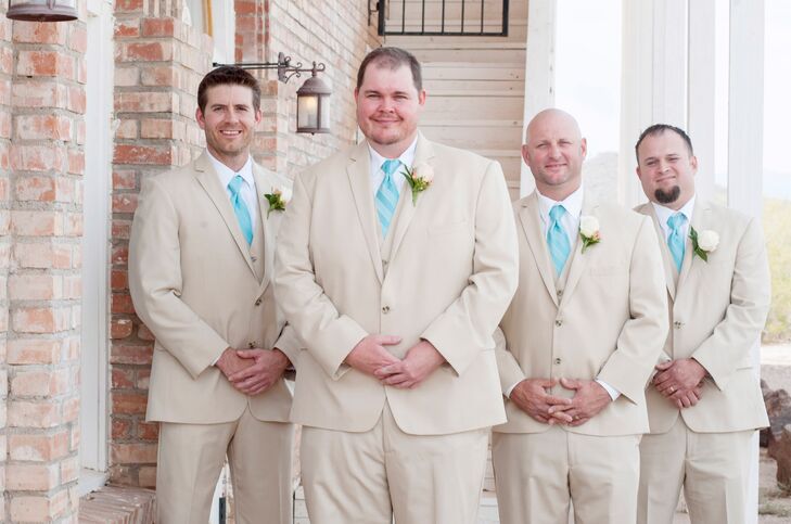 Jon and his groomsmen wore light beige suits with aqua ties to fit the spring season.