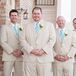 Jon and his groomsmen wore light beige suits with aqua ties to fit the spring season.