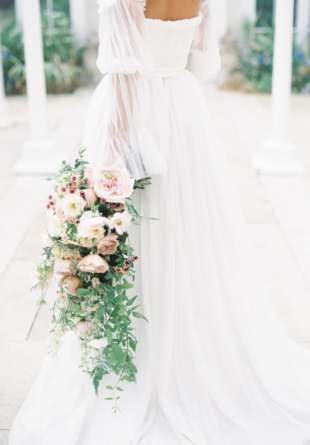 close up of flowing sheer wedding dress with balloon sleeves
