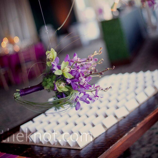 Though the cards were simple, hanging the bridal party bouquets above the display was an unexpected touch (and a nice way to recycle the flowers after the ceremony).