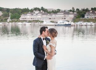 Bianca Moiseff (27 and a medical student) and Aaron Palushaj (26 and a professional hockey player) used an abundance of greenery and candlelight to ma
