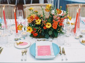 Long Table With White Linen, Blue Charger, Pink Menu and Colored Centerpiece