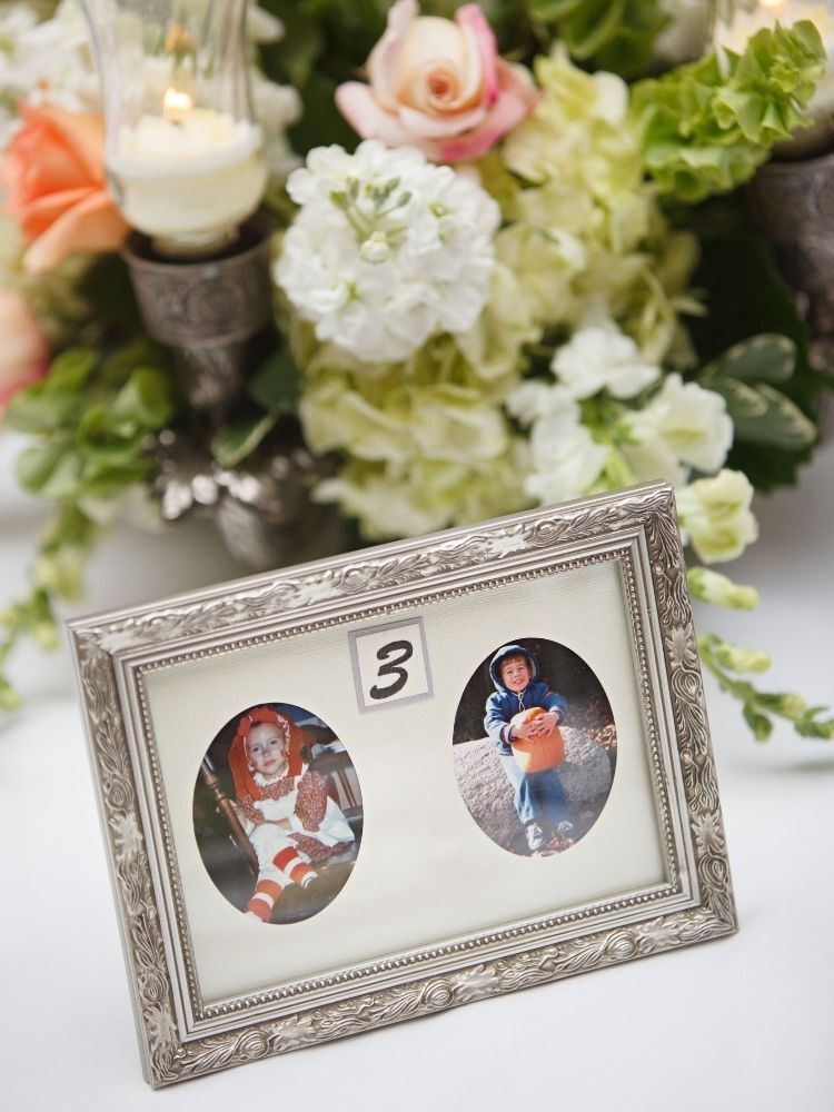 framed childhood photos as wedding table numbers