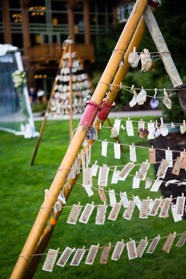 "Our escort cards attached to clothespins hung from a teepee-like structure made of old wooden rowboat oars, faded by years of use in the sun and saltwater along Hood Canal," Michelle says. "These oars came directly from my husband’s family beach house. The design and execution were left to some of the more crafty members of our extended family."