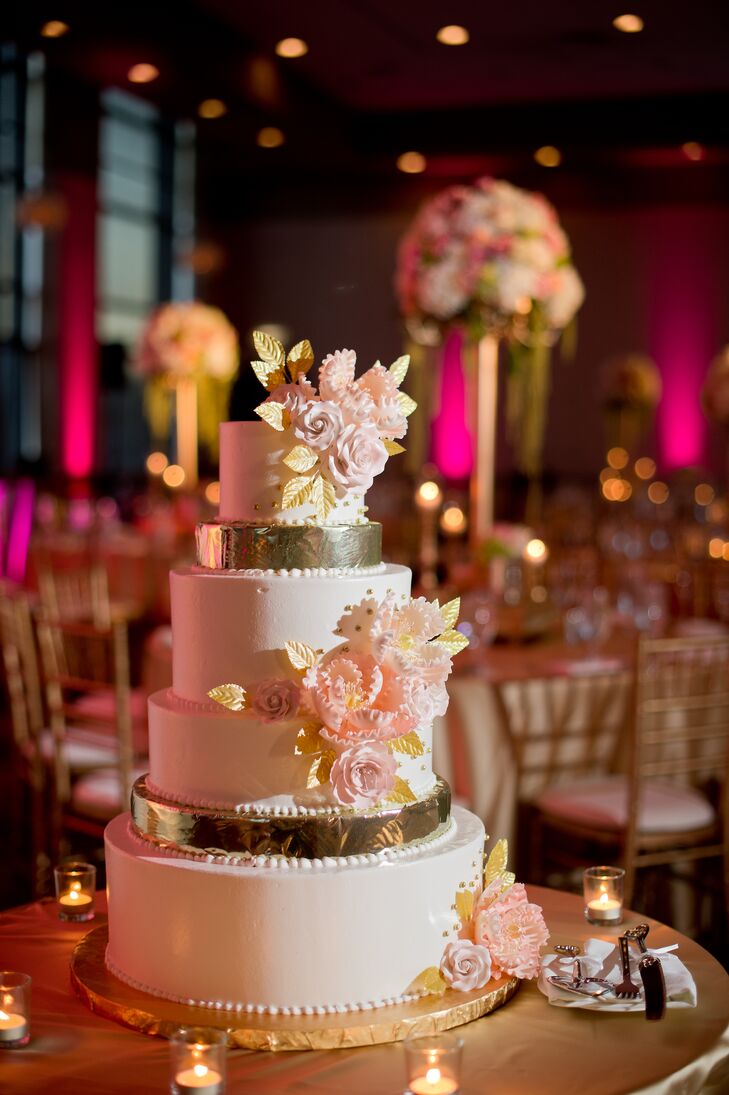 While Megha and Hari had a traditional Indian ceremony, they incorporated some Western traditions into the ceremony, like a cake cutting and first dance. “We wanted our cake to match the overall theme of the wedding,” Megha says. “I had Baking Institute play off of my centerpieces and bridal bouquet to create my cake. They were able to mimic some of our flowers by creating sugar flowers with gold foil.”
